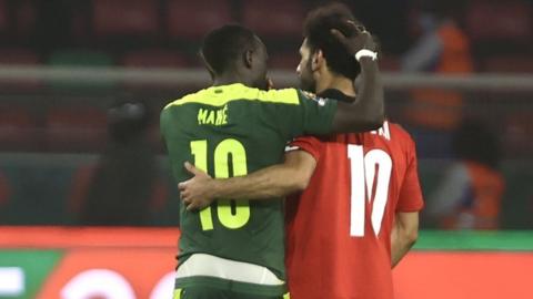 Senegal's Sadio Mane consoles Mohamed Salah after Egypt lose the 2021 Africa Cup of Nations final