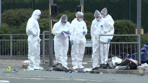 Forensic experts at the scene of a crash in St Helens