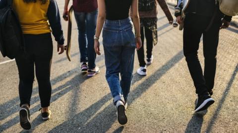 Stock image of school pupils walking