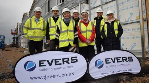 Essex councillors Lesley Wagland and Mary Newton in Jaywick Sands with council officers and construction workers