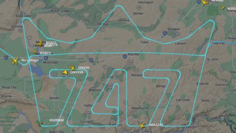 Image showing flight path of last 747 plane. Path depicts a crown with the numbers 747 displayed.