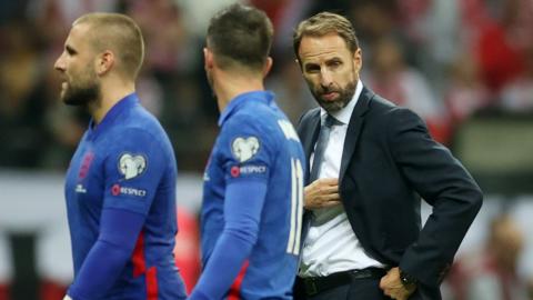 England boss Gareth Southgate and his players react after drawing to Poland in World Cup qualifying