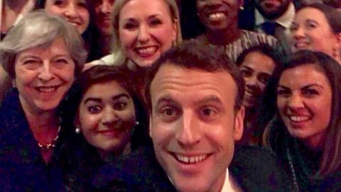 Theresa May and Emmanuel Macron pose for selfie