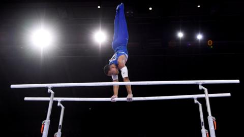 A gymnast on bars