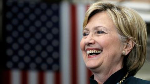 US Democratic presidential candidate Hillary Clinton smiles as she listens to her introduction at a campaign event in Athens, West Virginia.