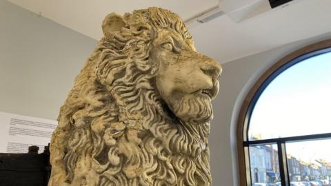 A stone lion, formerly displayed at Tall Trees nightclub