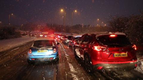 Cars stuck in traffic on Ringway West in Basingstoke due to snowfall in the area on Friday 1 February
