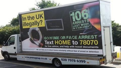 Home Office van bearing the slogan "In the UK illegally? Go home or face arrest"