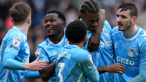 Haji Wright of Coventry City celebrates with his teammates after scoring