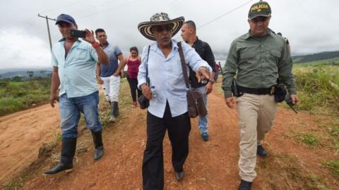 FARC rebels commander Joaquin Gomez (C) arrives at the Transitional Standardization Zone Mariana Paez, Buena vista, Mesetas municipality, Colombia on June 26, 2017,