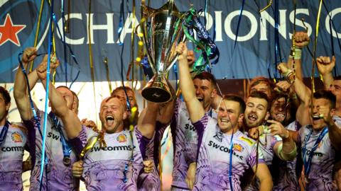 Exeter celebrate with the Champions Cup trophy