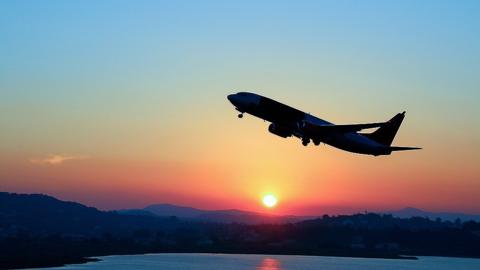 Plane takeoff sunset