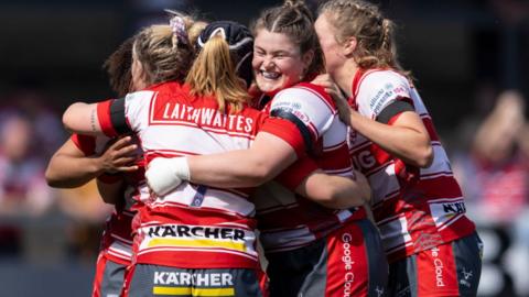 Gloucester-Hartpury players celebrate their thumping win over Harlequins