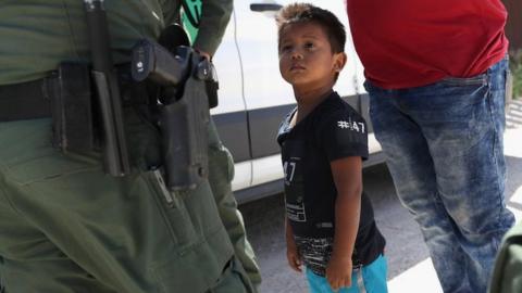 Border patrol agents detain migrants near US-Mexico border, 12 June 2018