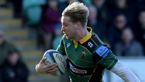 Harry Mallinder charges past Rotimi Segun to scores Saints' second try after only five minutes at Northampton