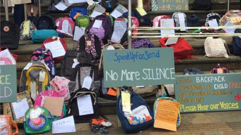 Backpacks laid at Shire Hall in Warwick