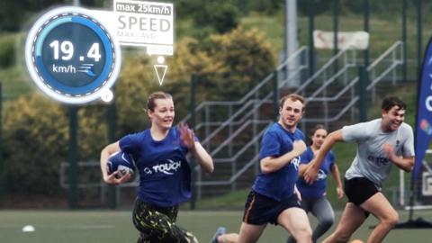 Women and men playing touch rugby