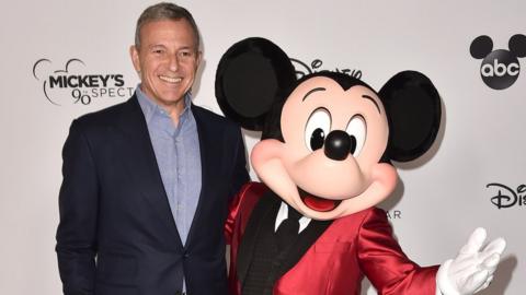 Bob Iger and Mickey Mouse attend Mickey's 90th Spectacular at The Shrine Auditorium on October 6, 2018 in Los Angeles, California.
