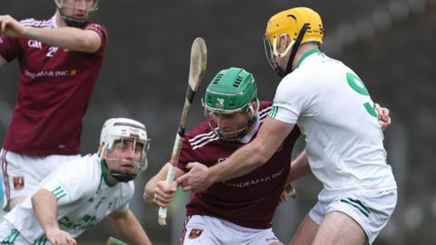 Cushendall's Neill McCormack battles with Cian Loy of O’Loughlin Gaels