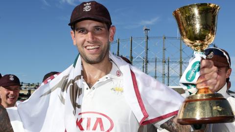 Jade Dernbach celebrates with the County Championship trophy in 2018