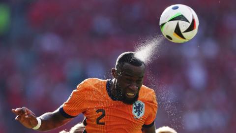 The Netherlands' Lutsharel Geertruida heads the ball in the Euro 2024 group game against Austria