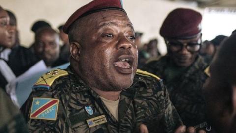 Colonel Mike Mikombe (C), one of the accused Republican Guard officers, argues with a lawyer after the hearing at the military court of Goma, eastern Democratic Republic of Congo, on September 6, 2023.