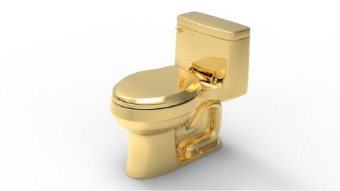 A gold toilet