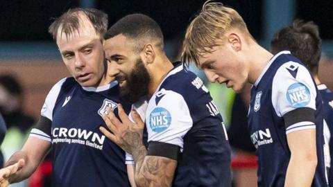 Paul McGowan (left) celebrates his goal