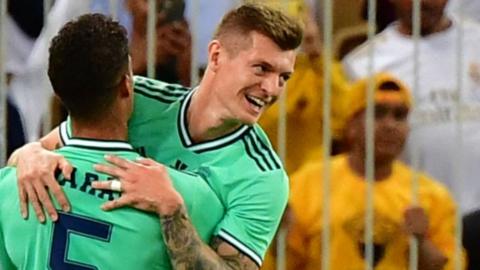 Real Madrid's Toni Kroos celebrates with Raphael Varane