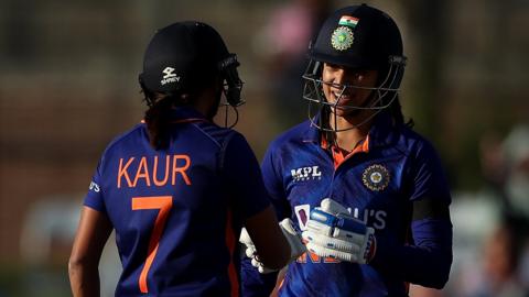 India batters Harmanpreet Kaur (left) and Smriti Mandhana (right) touch gloves