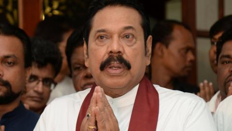 Mahinda Rajapaksa attends a religious ceremony after he resigned from the prime minister post in Colombo, Sri Lanka December 15, 2018