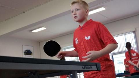 Pupil playing table tennis