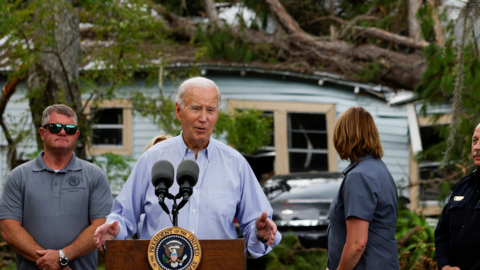 President Joe Biden speaking in front of a house damaged by Hurricane Idalia in the town of Live Oak, Florida