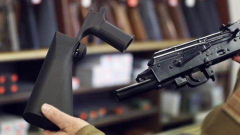 Bump Stock being attached to a gun