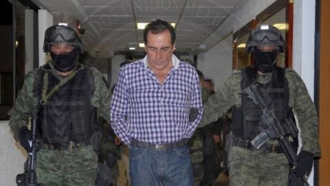 Soldiers escort head of the Beltran Leyva drug cartel Hector Beltran Leyva in Mexico City, in this handout picture taken October 1, 2014
