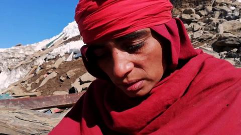 Woman in aftermath of avalanche in Neelum Valley