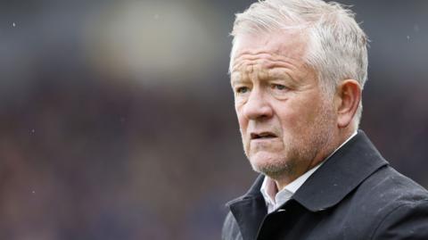 Chris Wilder looks on