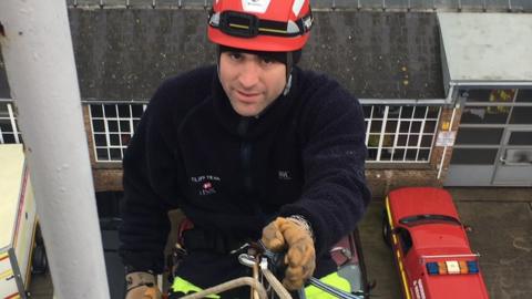A Guernsey cliff rescue volunteer abseiling