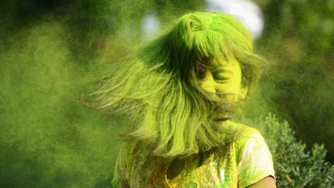 Child with coloured powder in her hair