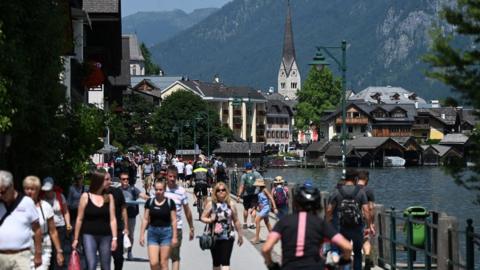 Tourists visit the town of Hallstatt on Lake Hallstatt