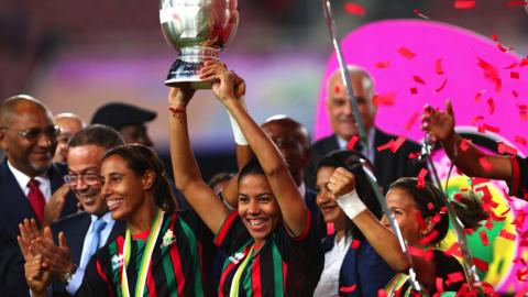 AS FAR players lift the Women's African Champions League trophy