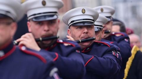 Bandsmen playing their flutes as they march during the Apprentice Boys parade in Londonderry