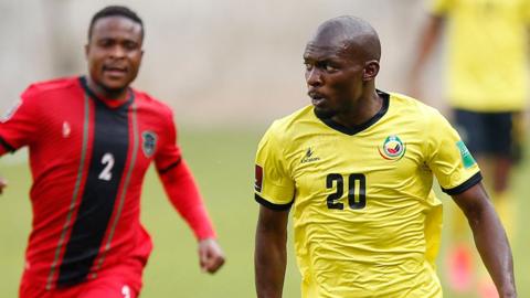 Mozambique's Bruno Langa (right) controls the ball in a game against Malawi