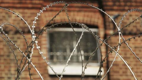 Prison with barbed wire around it