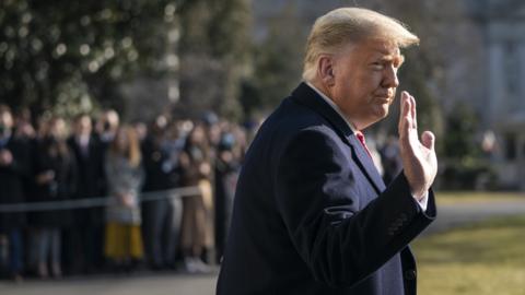 Donald Trump waves as he walks to Marine One on the South Lawn of the White House on 12 January