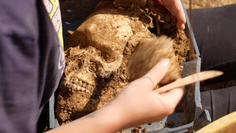 Skeleton in medieval graveyard