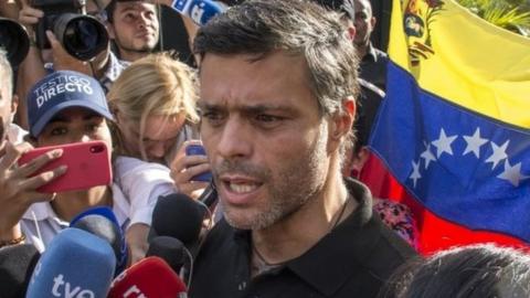 Opposition figure Leopoldo López speaks to reporters at the gate of the Spanish embassy in Caracas, Venezuela. Photo: 2 May 2019