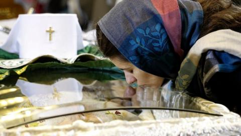 Orthodox believer pays last respect to the late Serbian Patriarch Irinej on November 21, 2020 in Belgrade, Serbia.