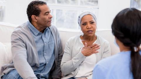 Couple talking to a doctor