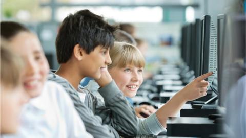 Students using computers in classroom (file image)